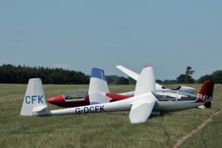 image of gliders parked on the ground