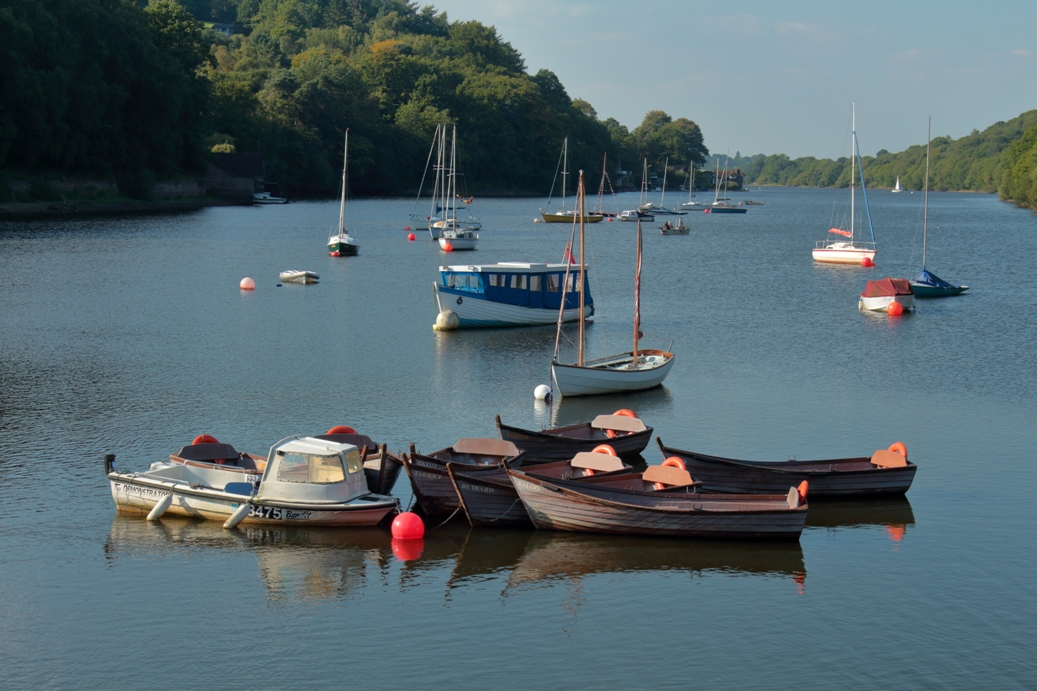 image of boats at anchor on a lake